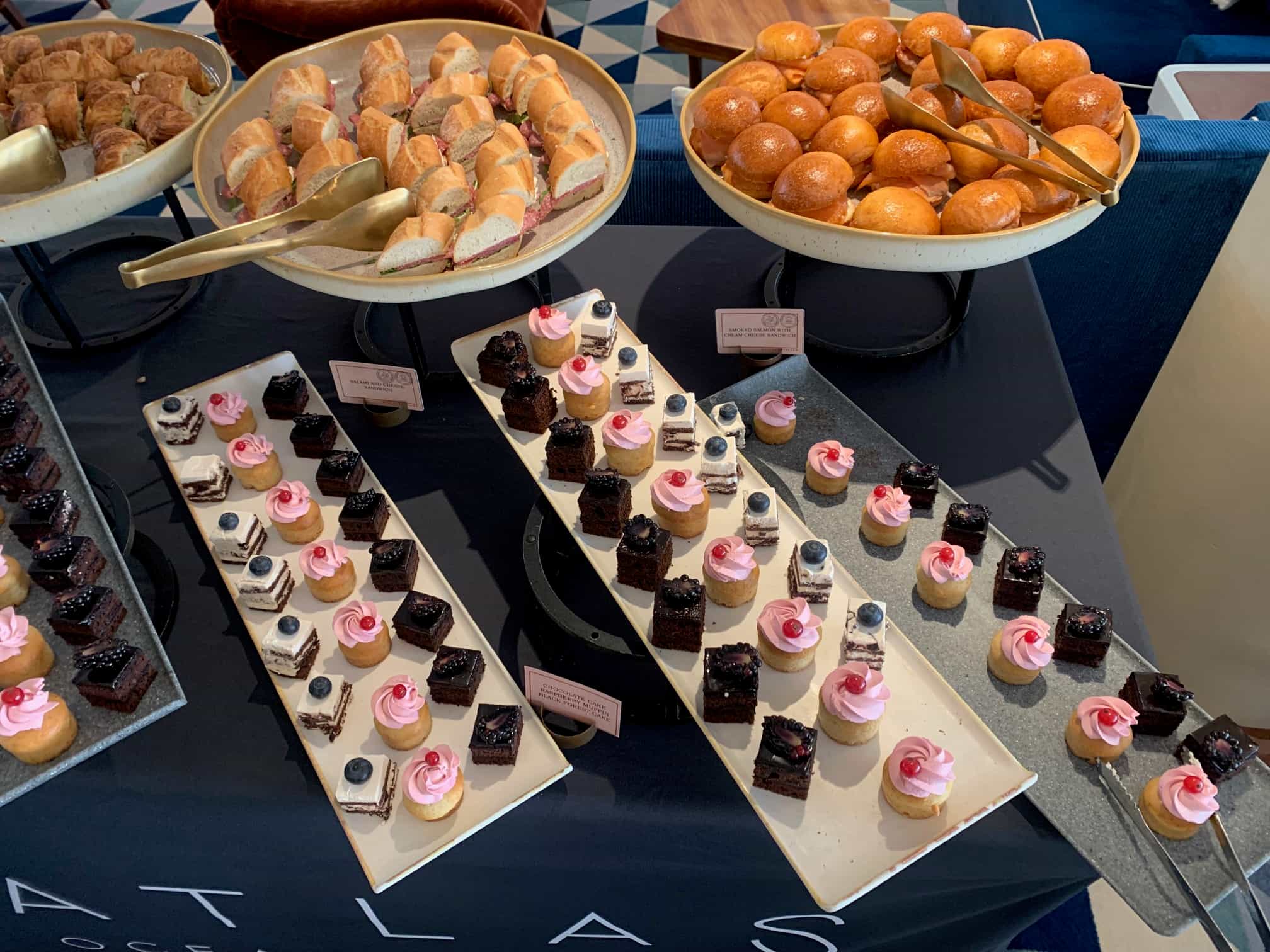 Cakes and sandwiches at Atlas cruise check-in